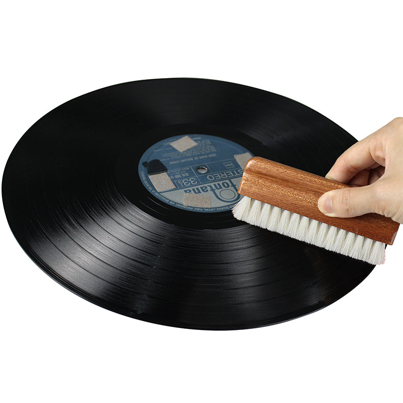 Person using the Vinyl Survival goat hair brush on a record